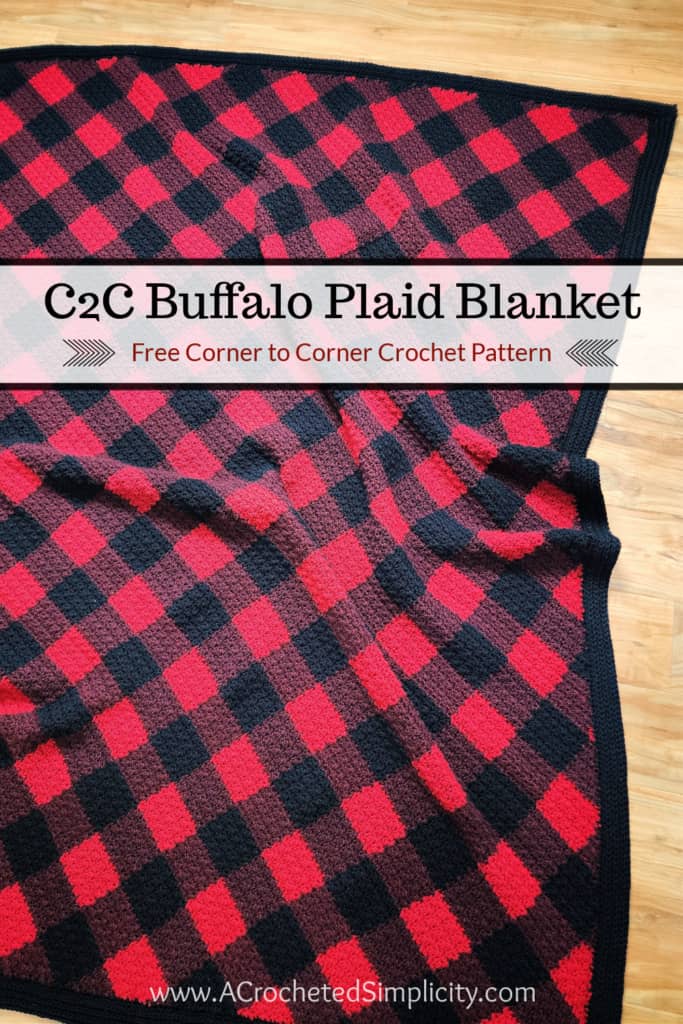 Image showing crochet buffalo plaid c2c blanket on wood flooring.