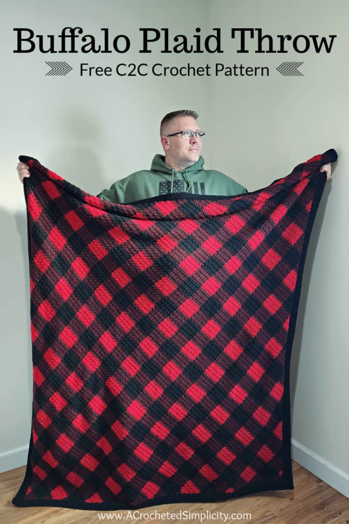 This image is of my husband proudly showing off his new C2C Crochet Buffalo Plaid Blanket!