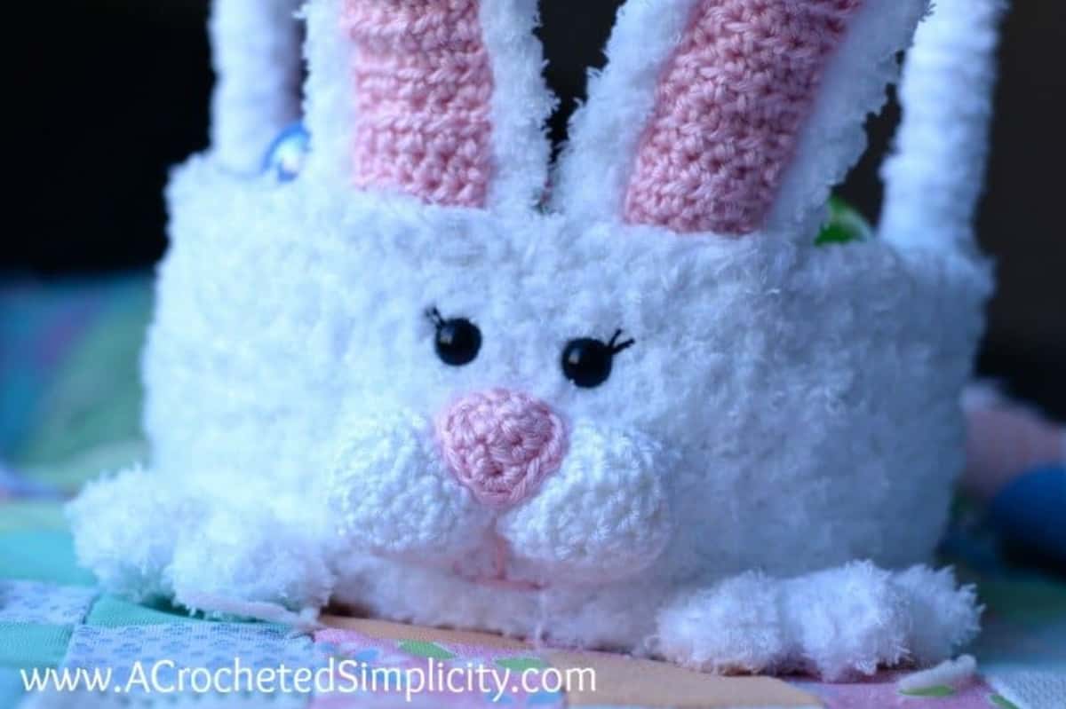 Close up of the face of an crochet Easter bunny basket.