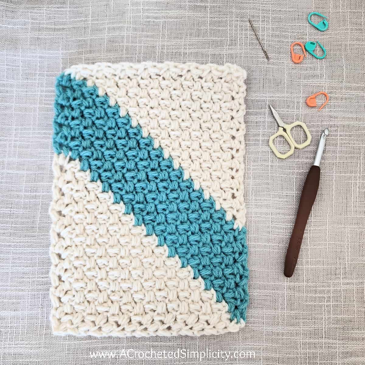 Image is of a c2c rectangle crocheted using the mini bean stitch