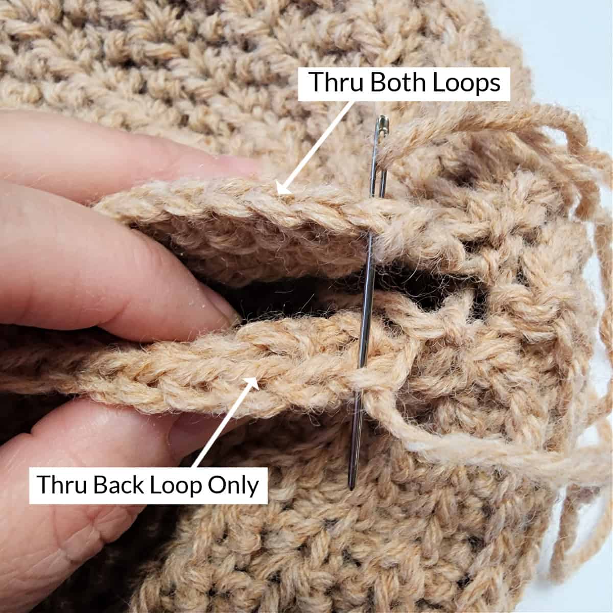 Yarn needle seaming crochet short row hat.