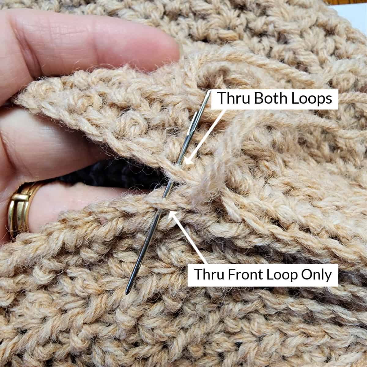 Photo showing how to seam the middle section of the seam along the crochet hat.