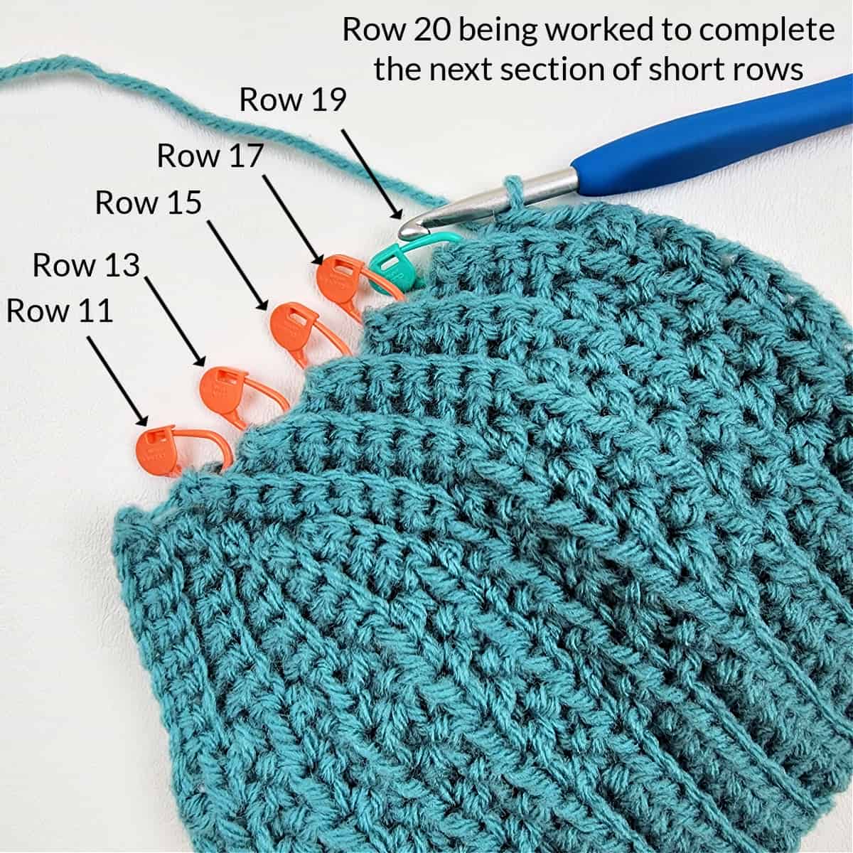 Locking stitch markers placed in all odd numbered rows of a section of crochet short rows.