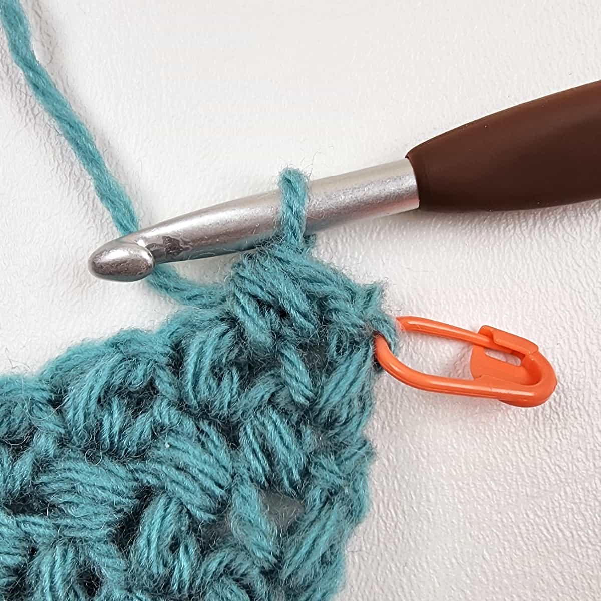 Small crochet swatch showing how to crochet a mini bean stitch.