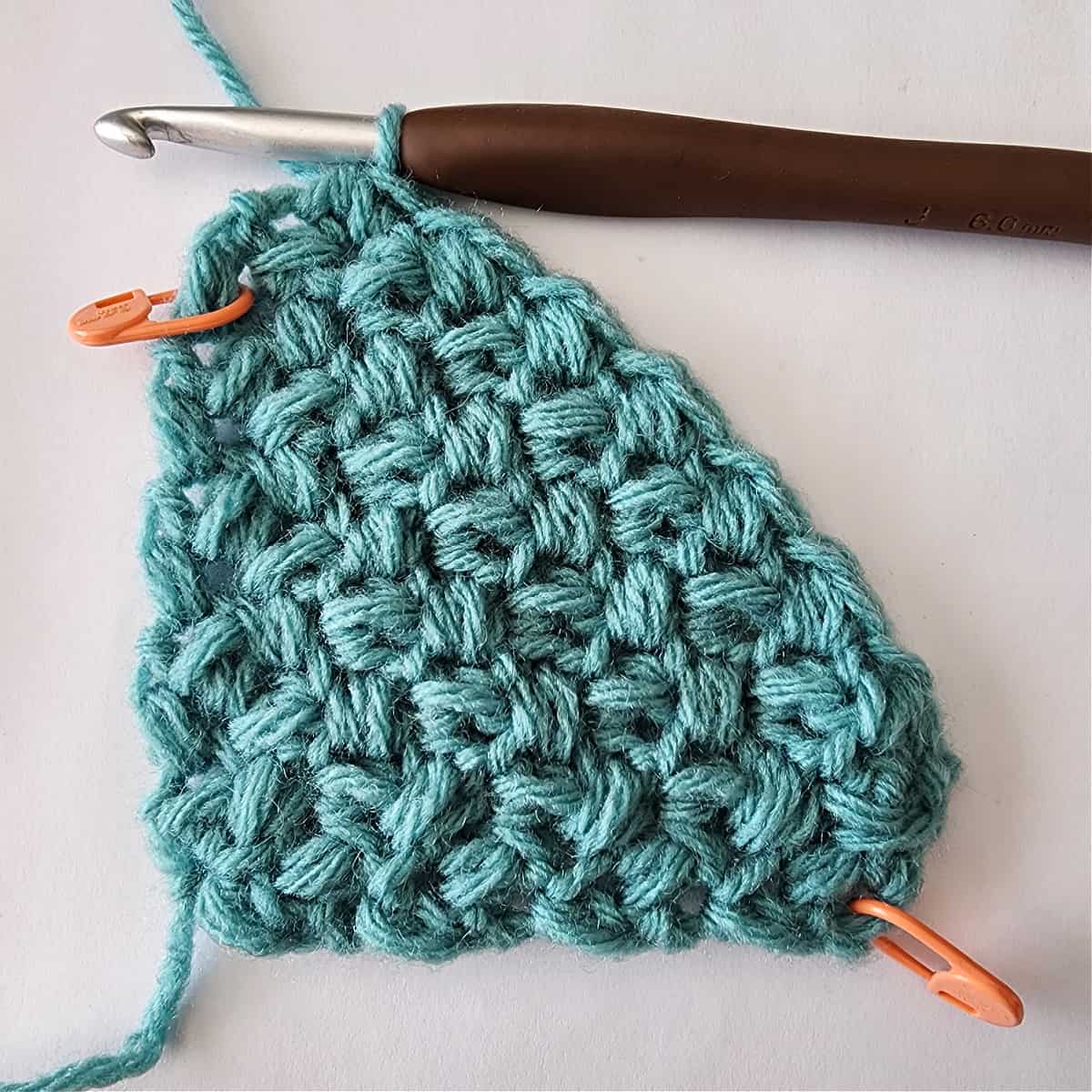 Aqua color yarn swatch of mini bean stitch worked corner to corner.