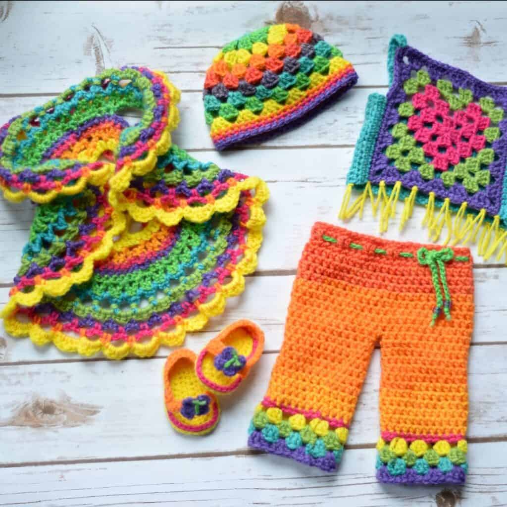 Five piece 18\" crochet doll clothes in rainbow colored Lion Brand Mandela Yarn.