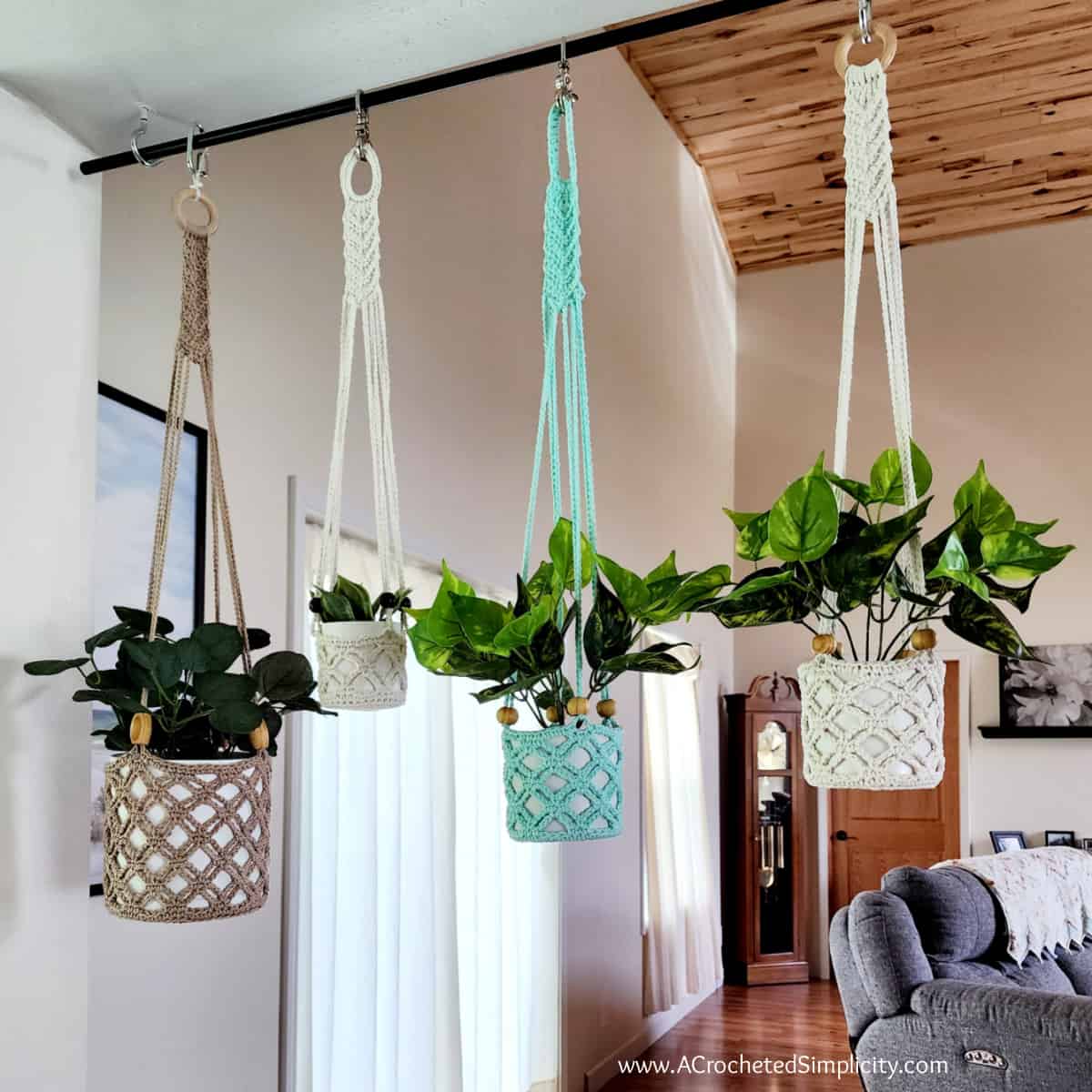 Four different crochet plant hangers in cotton yarn with wooden beads in square photo.