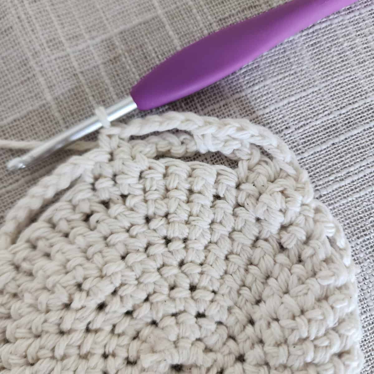 Close up of crochet lace pattern on plant basket.