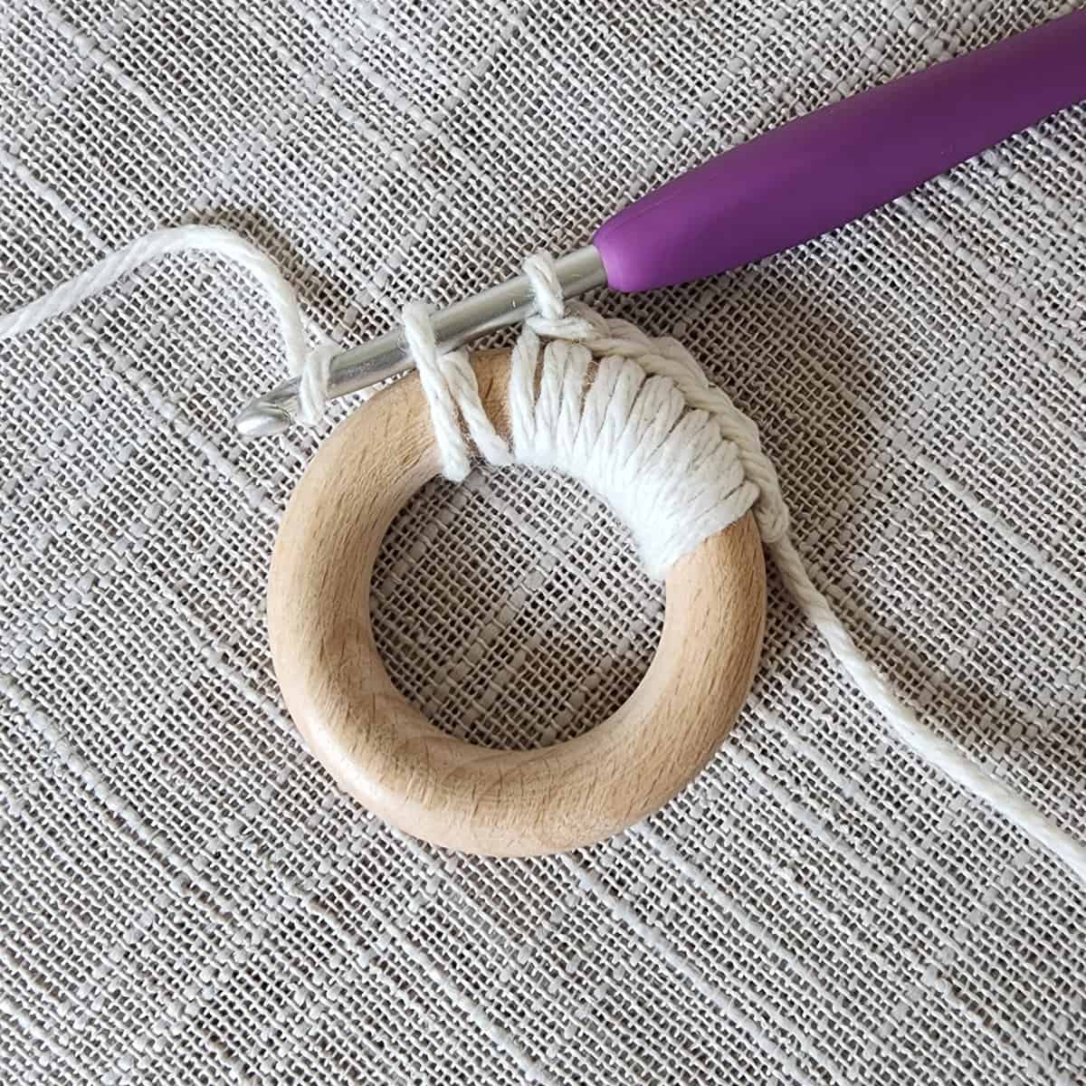 Single crochet around wood ring to create plant hanger.