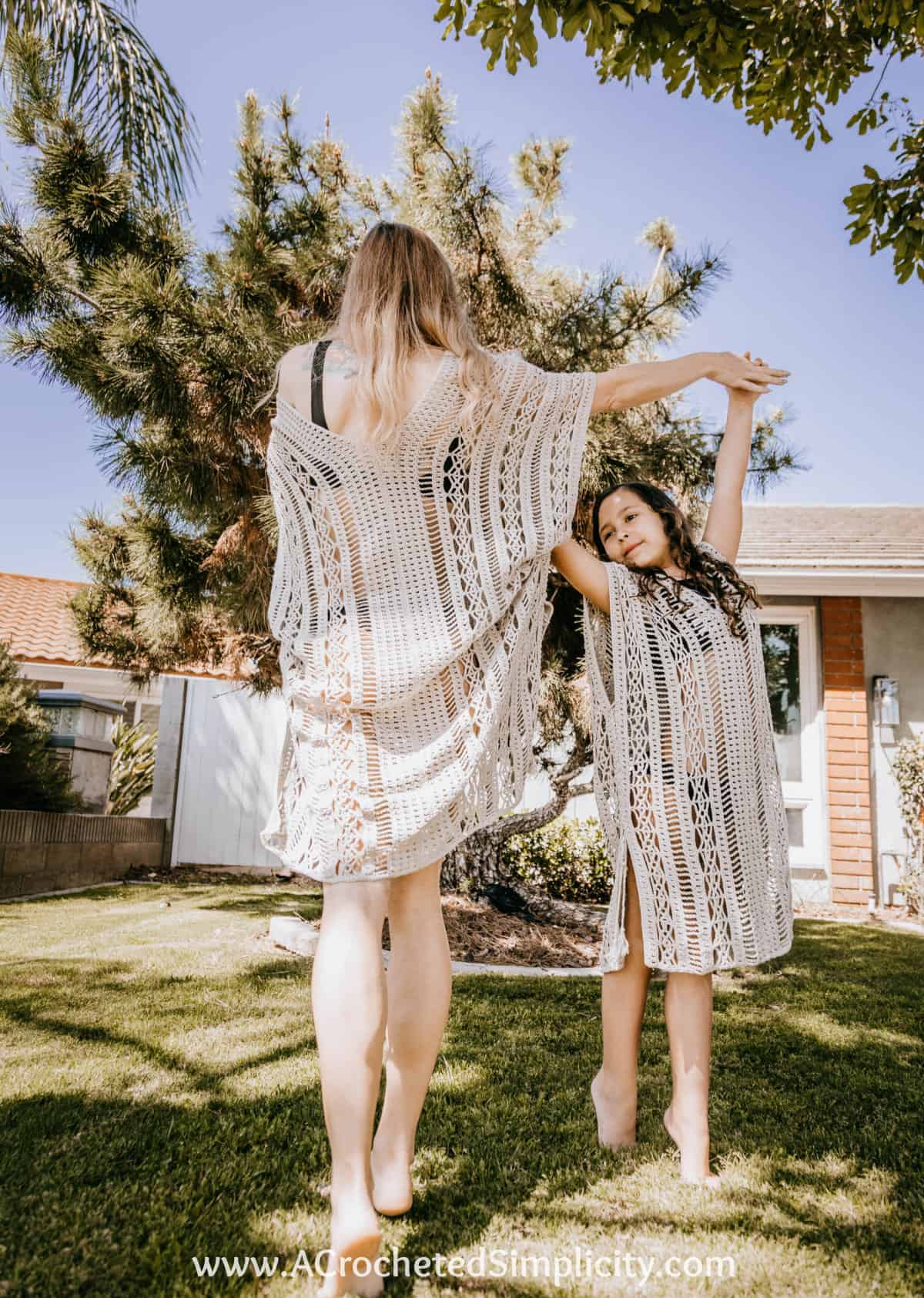 mom and daughter dancing in crochet swim cover ups