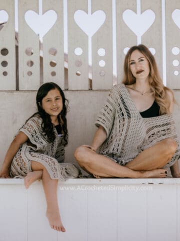Mother and daughter wearing matching crochet cover ups