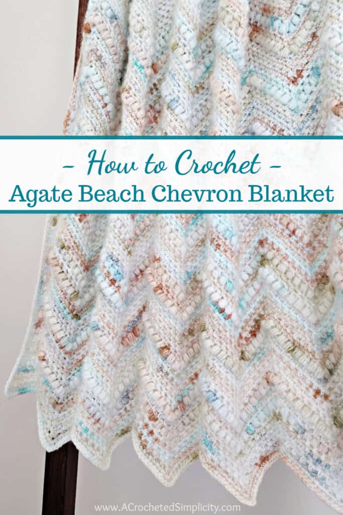 Crochet chevron blanket in the linen stitch with puff stitches and hanging on a blanket ladder.