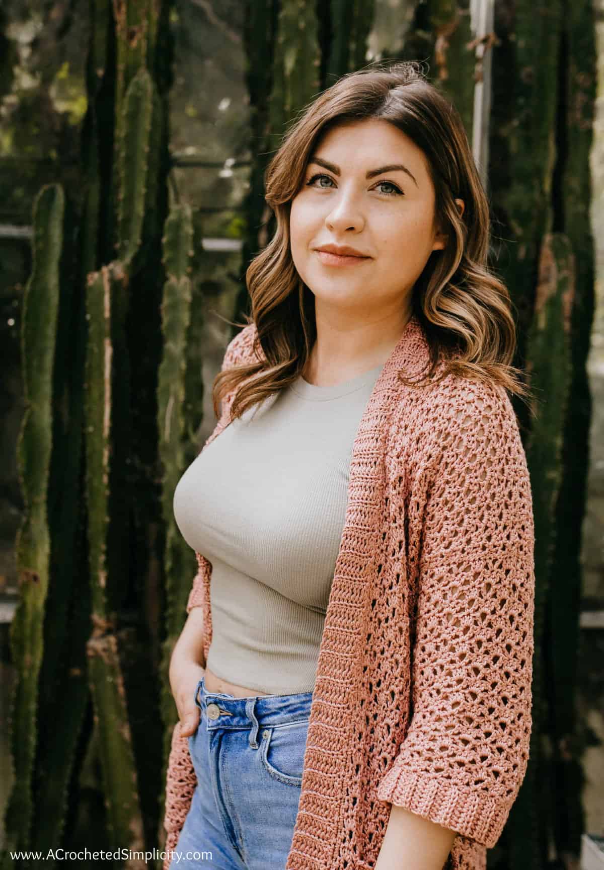 Close-up of a woman wearing a cotton crochet summer cardigan.