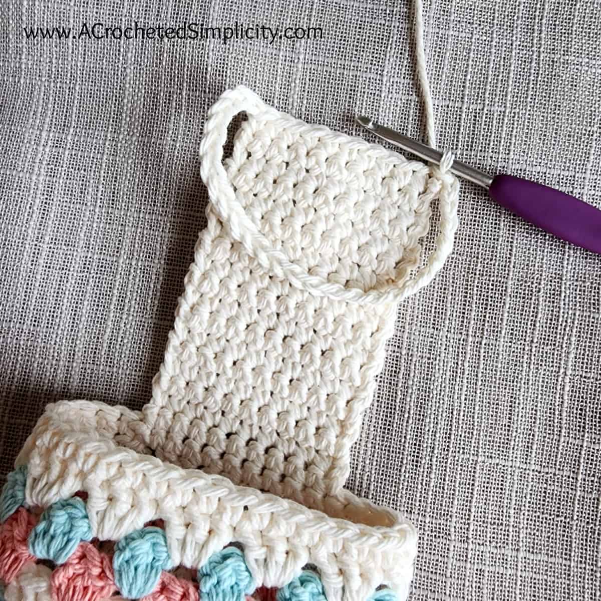 Join the crochet chain to the hanging strap on the chair caddy.