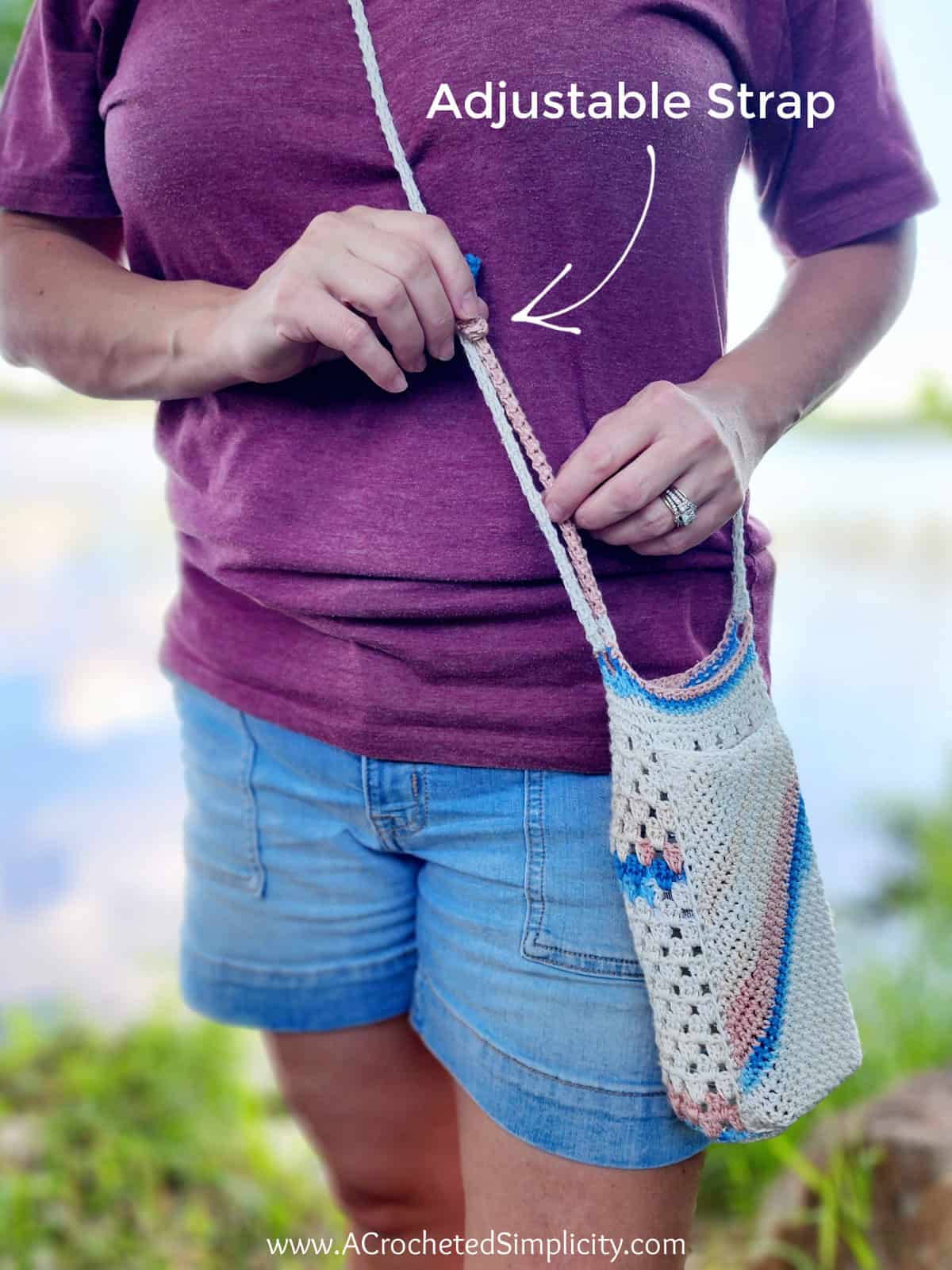 This photo is pointing out the adjustable crochet strap on the water bottle carrier.