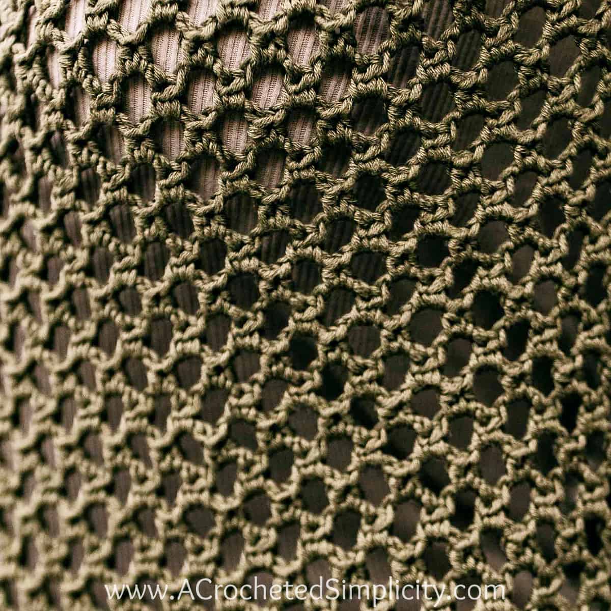 Honeycomb mesh crochet stitch swatch close up.