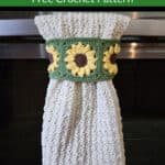 Sunflower keyhole crochet hand towel hanging on oven door.