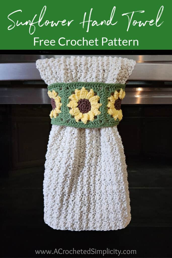 Sunflower keyhole crochet hand towel hanging on oven door.