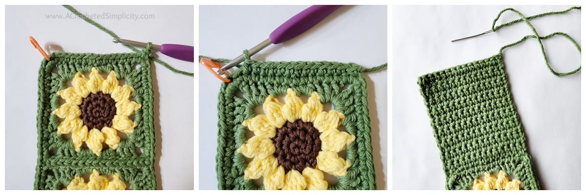 Small green and yellow sunflower crochet square with purple crochet hook edging up to an orange stitch marker.