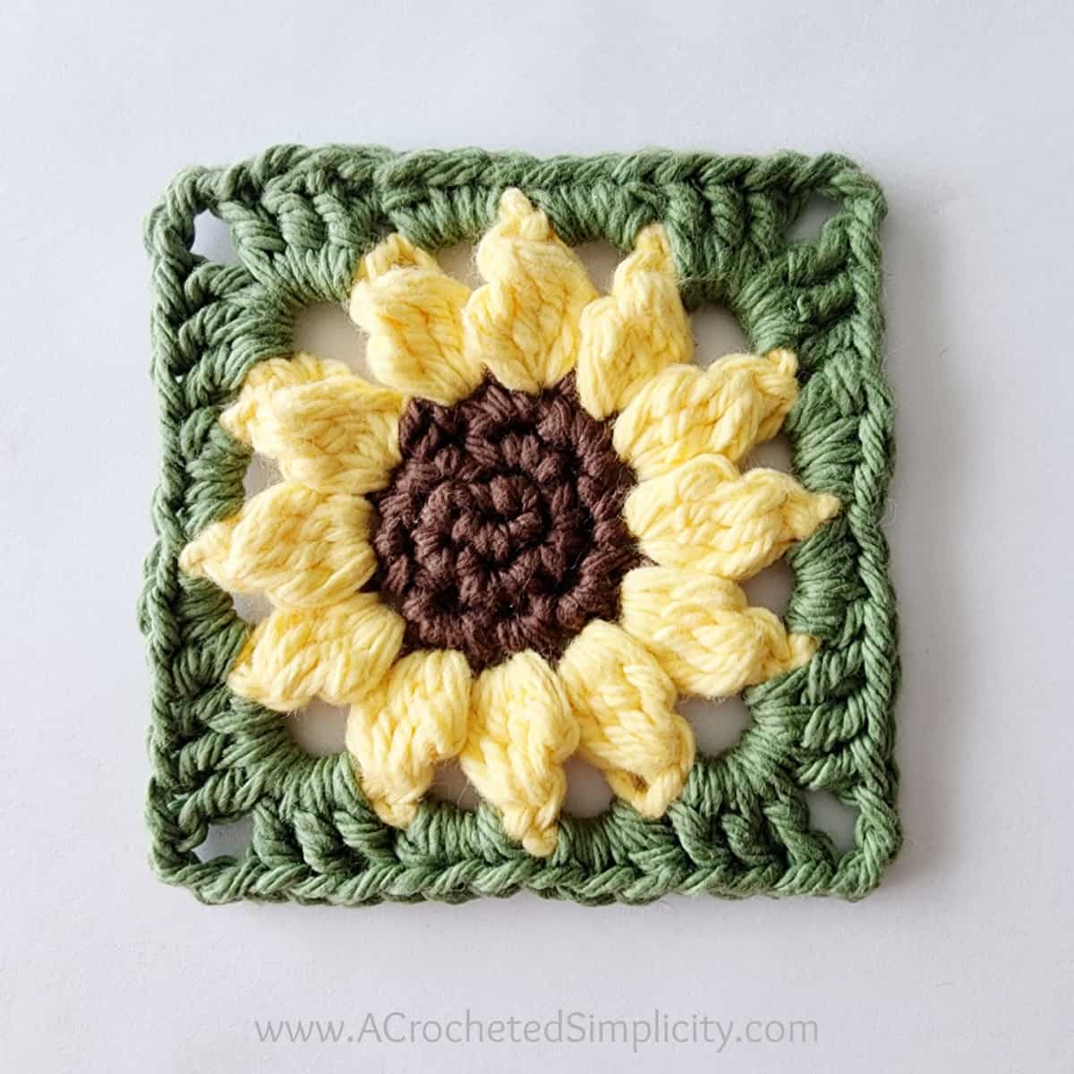 One completed crochet sunflower motif square.