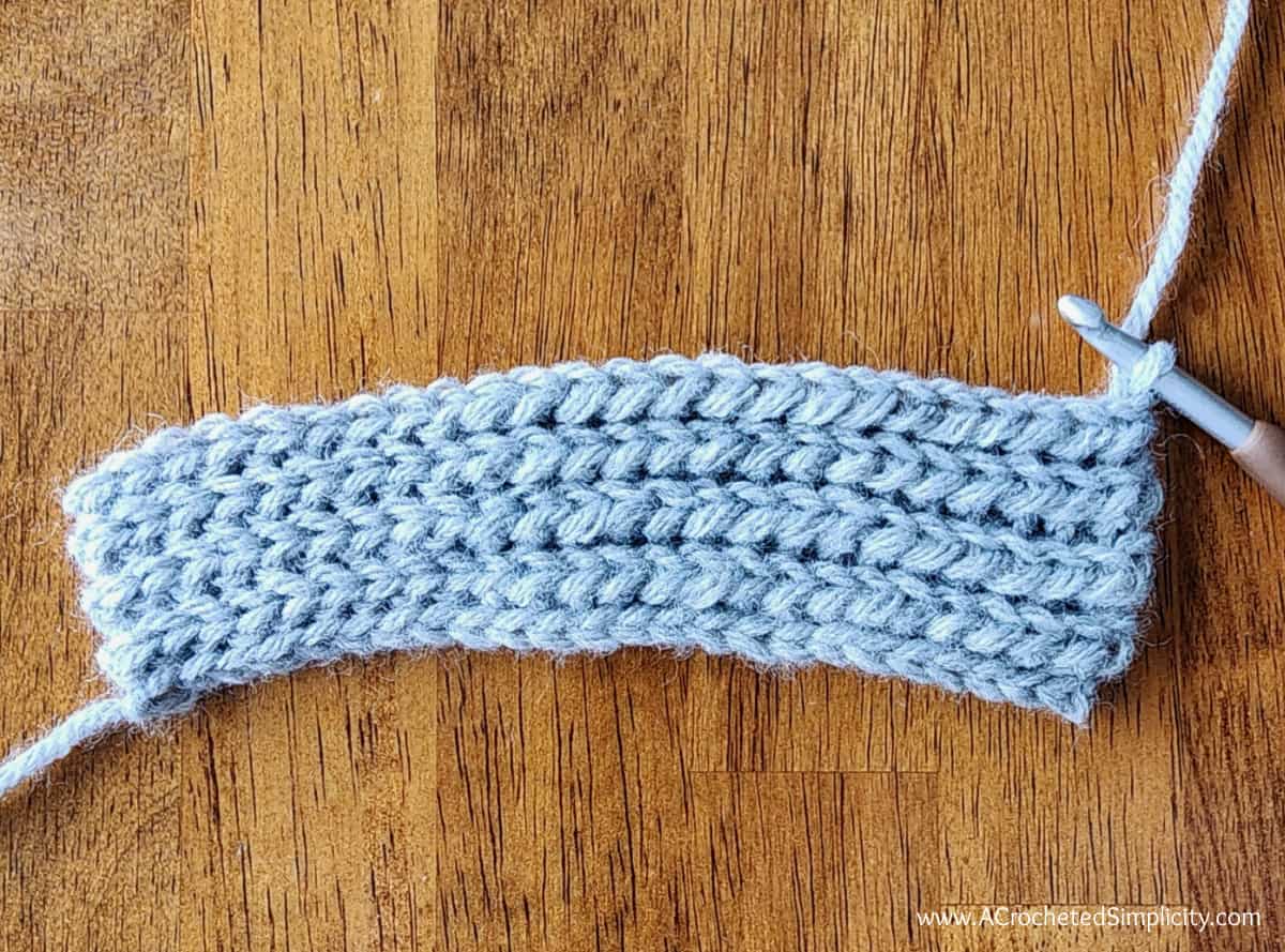 Small grey yarn swatch to show short row construction