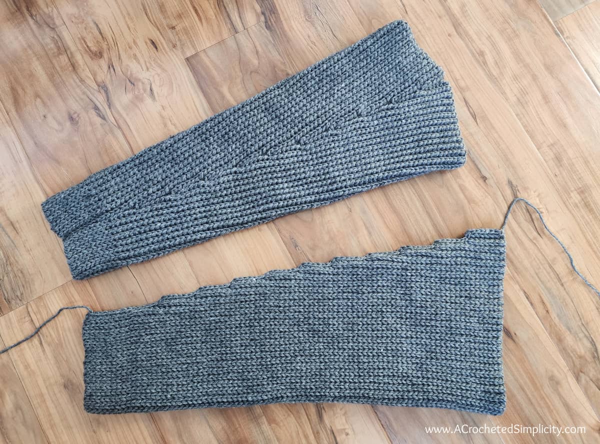 two cardigan sleeves completed, one right side out and the other inside out