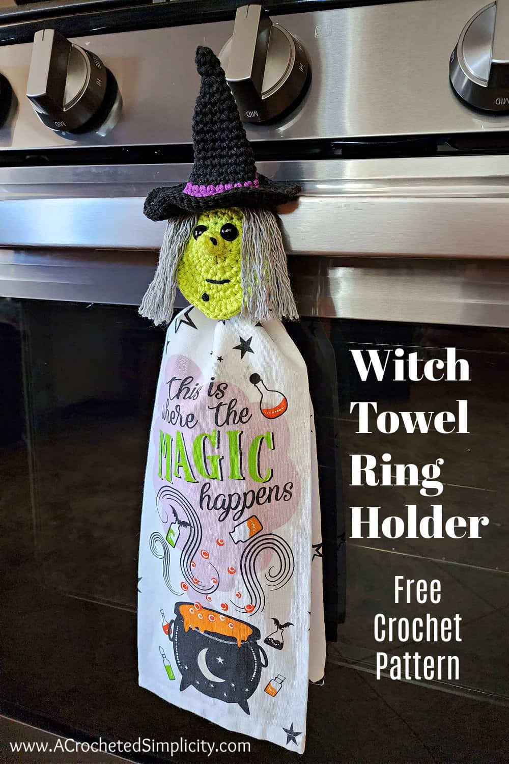 Small crochet witch head towel holder hanging on oven door handle.

