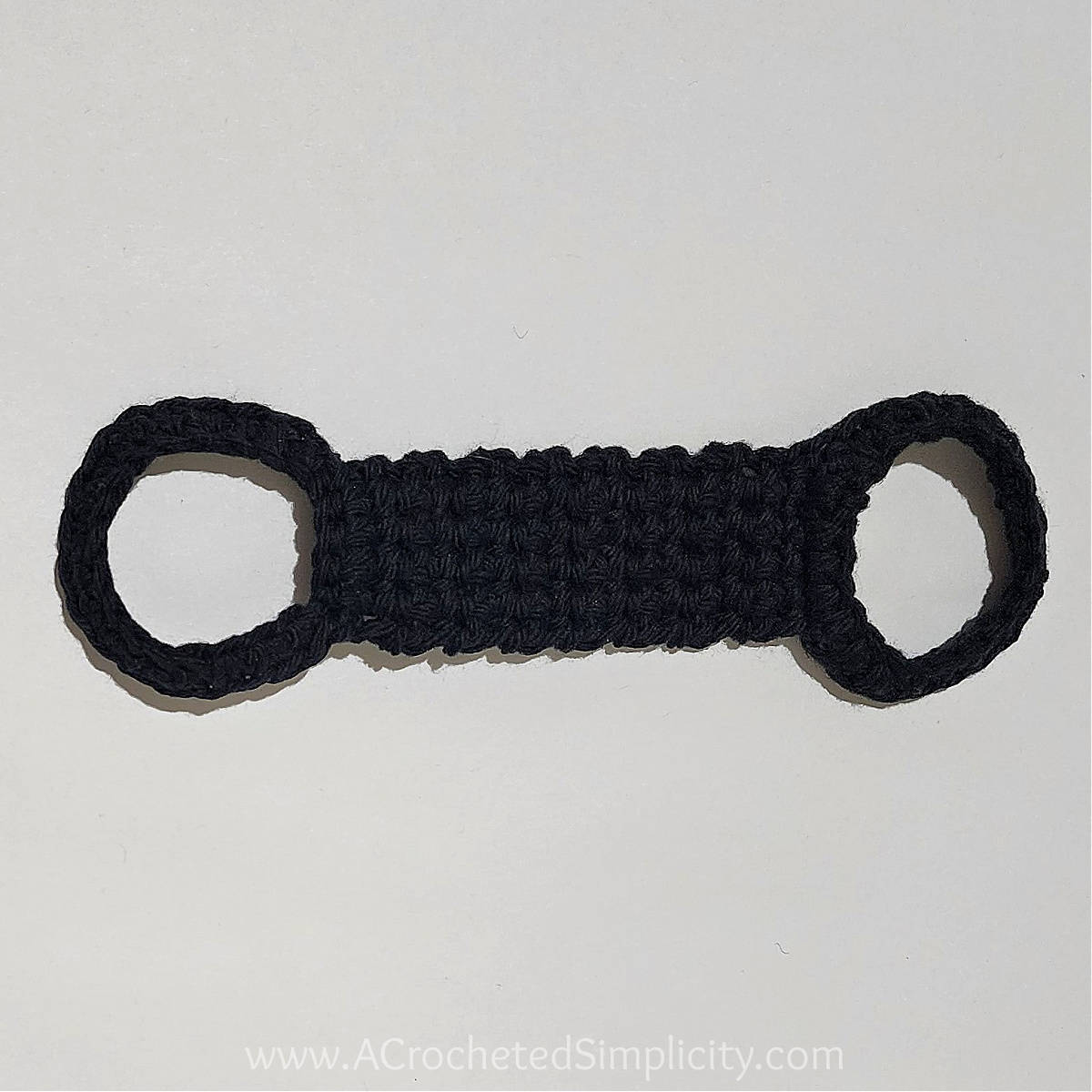 Crochet kitchen towel holder in black yarn