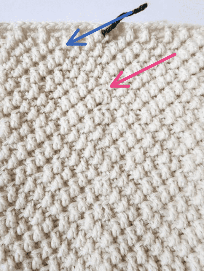 Cream crochet stocking pattern close up showing the seam