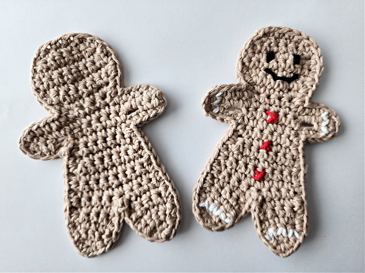 two crochet gingerbread ornaments waiting to be seamed.