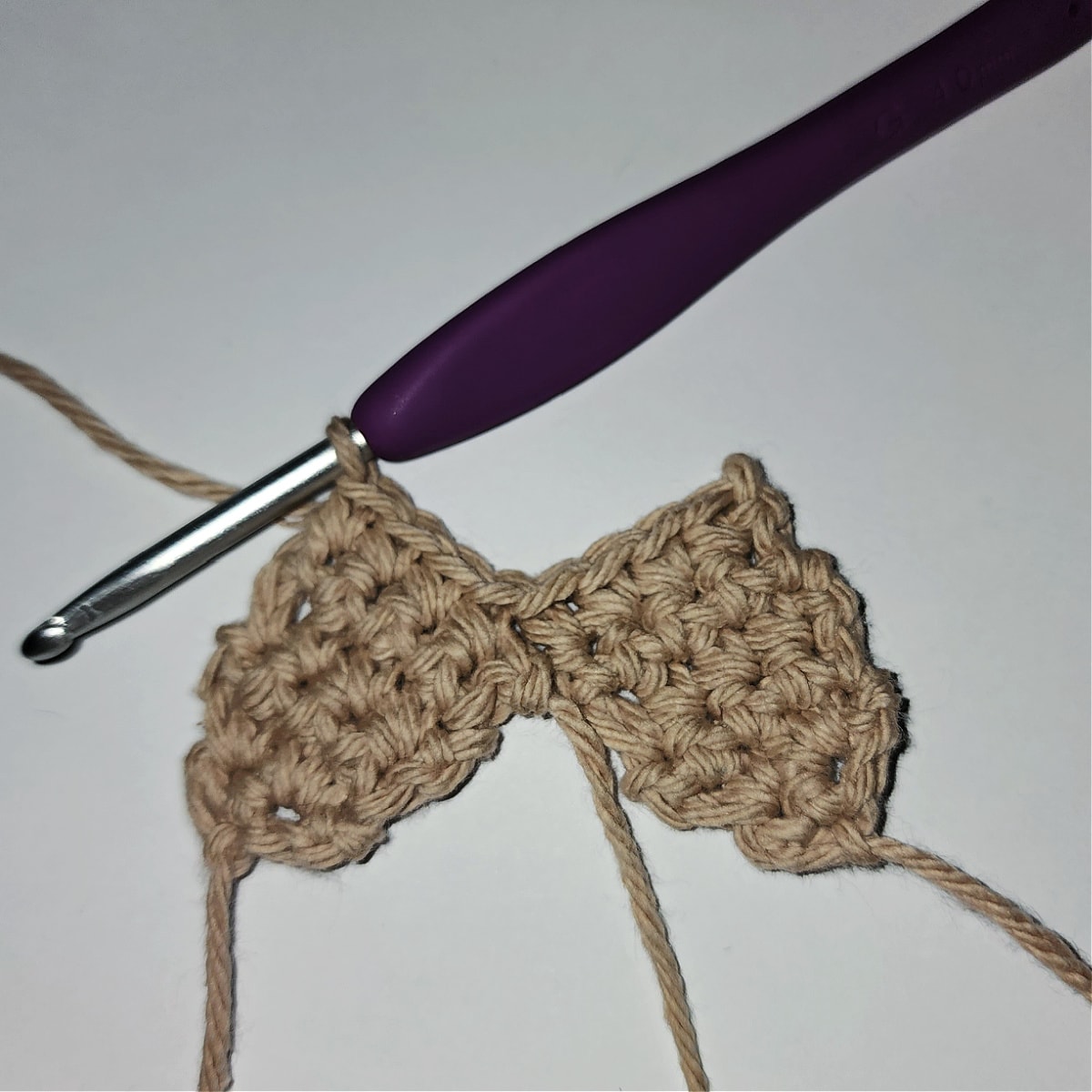 photo showing how to join two crochet legs for gingerbread person