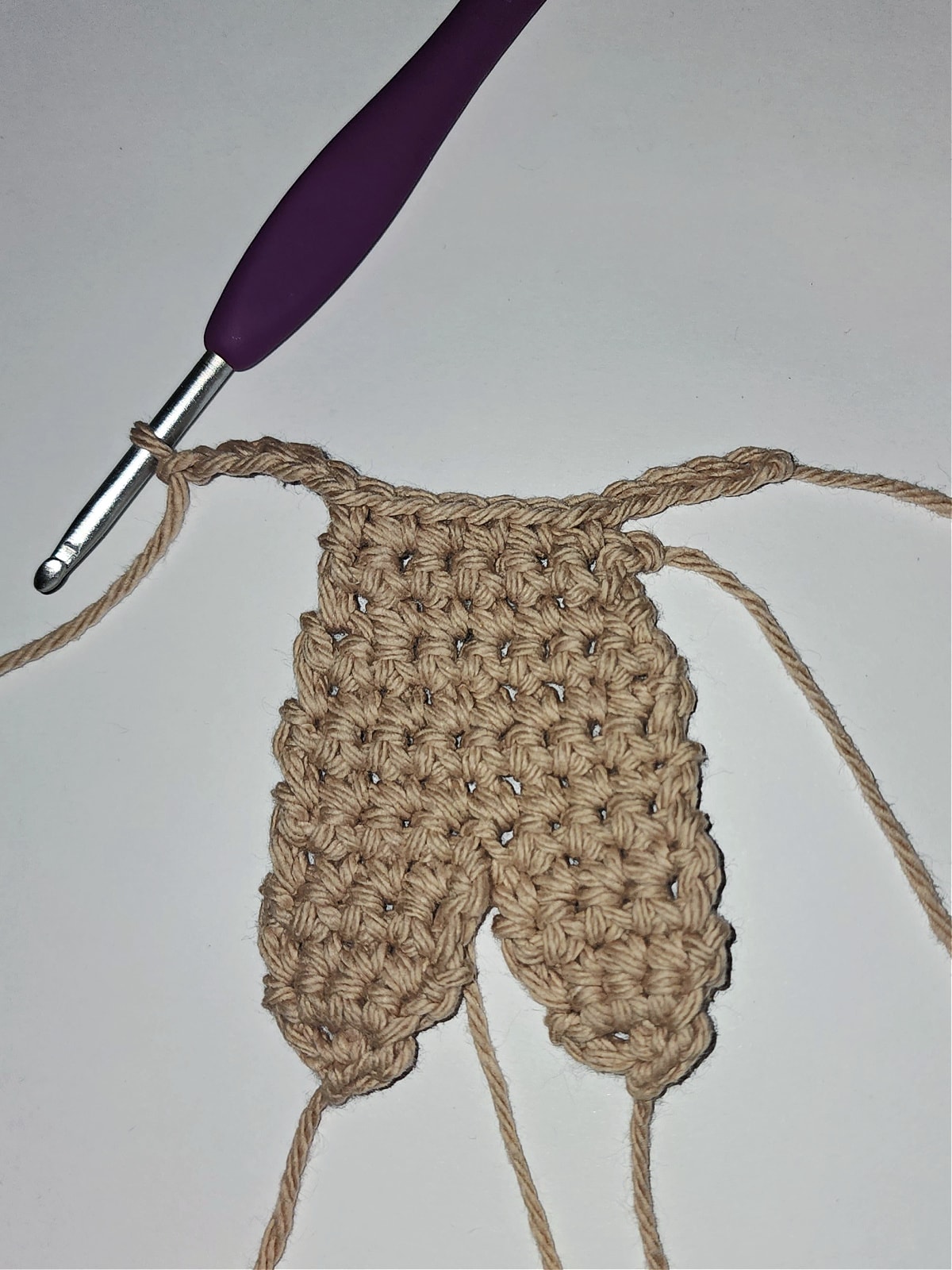 gingerbread man body with beginning of crochet arms