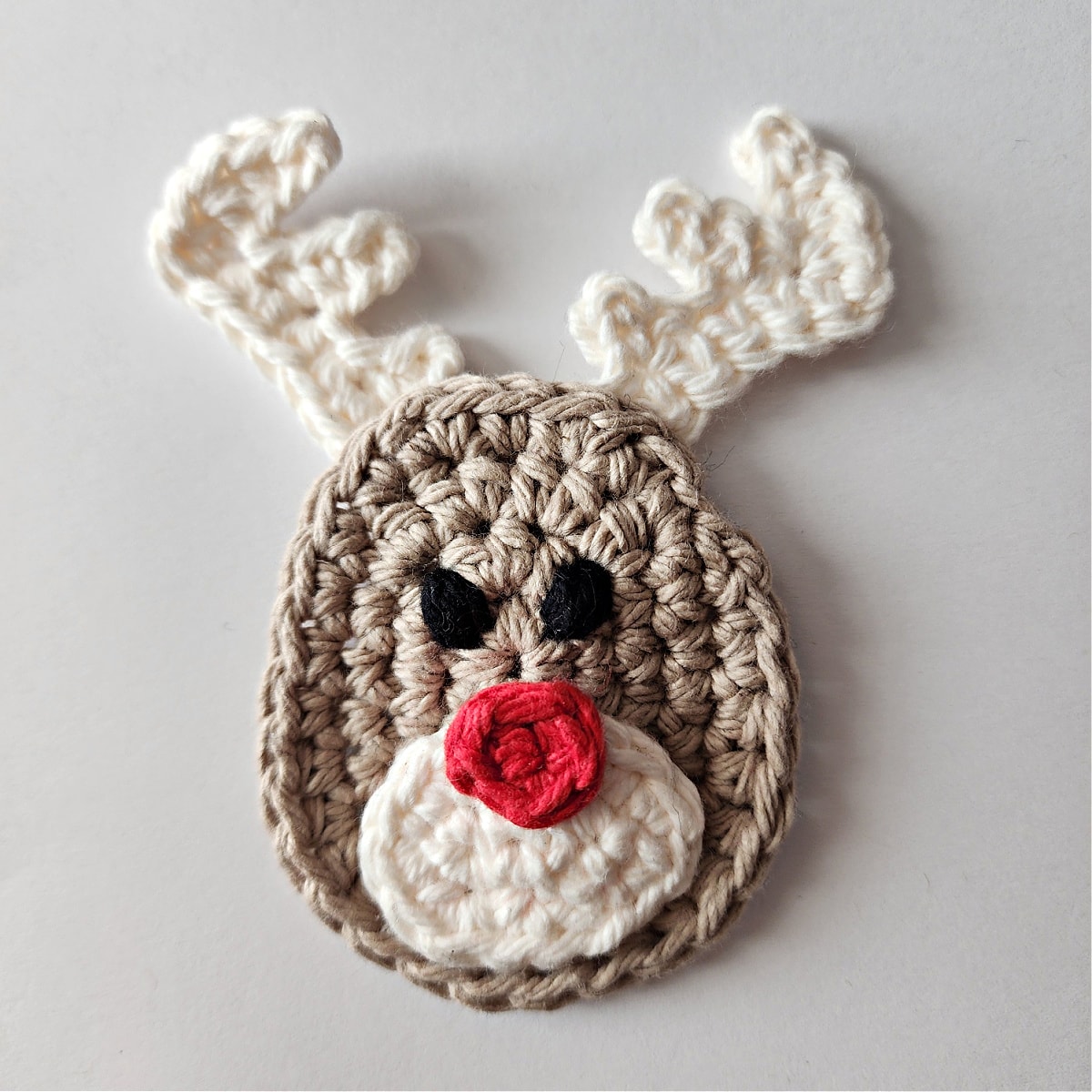 Crochet reindeer ornament tutorial for attaching the antlers.