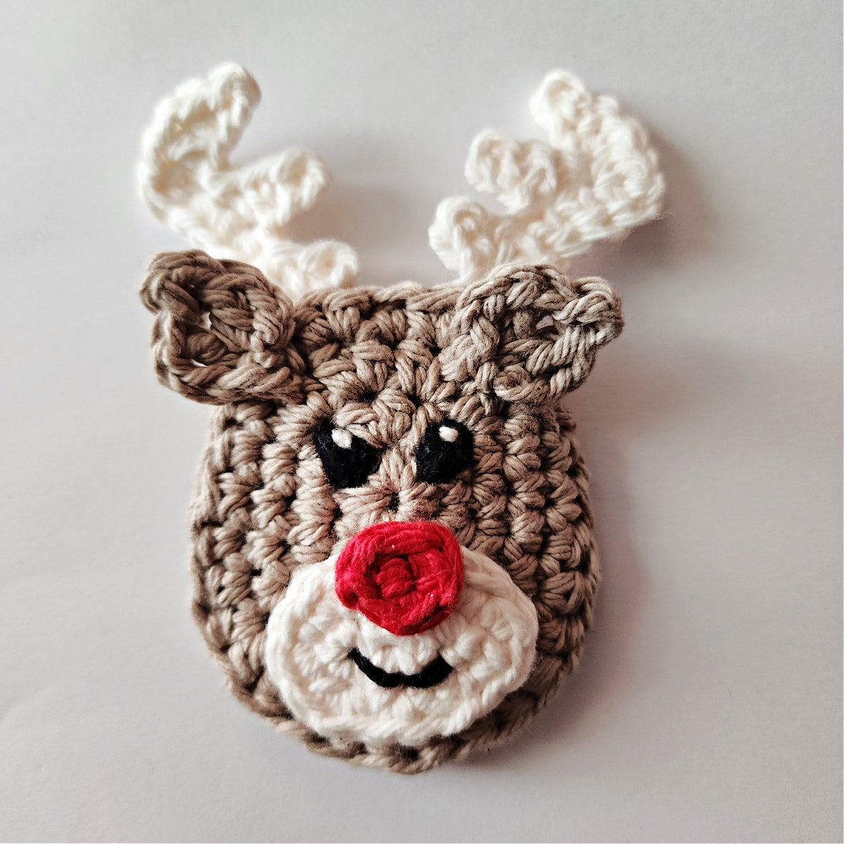 Completed reindeer ornament face.