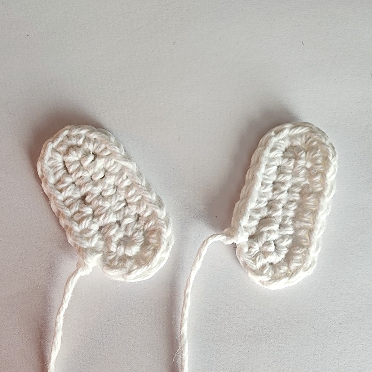 two crochet snowman hands