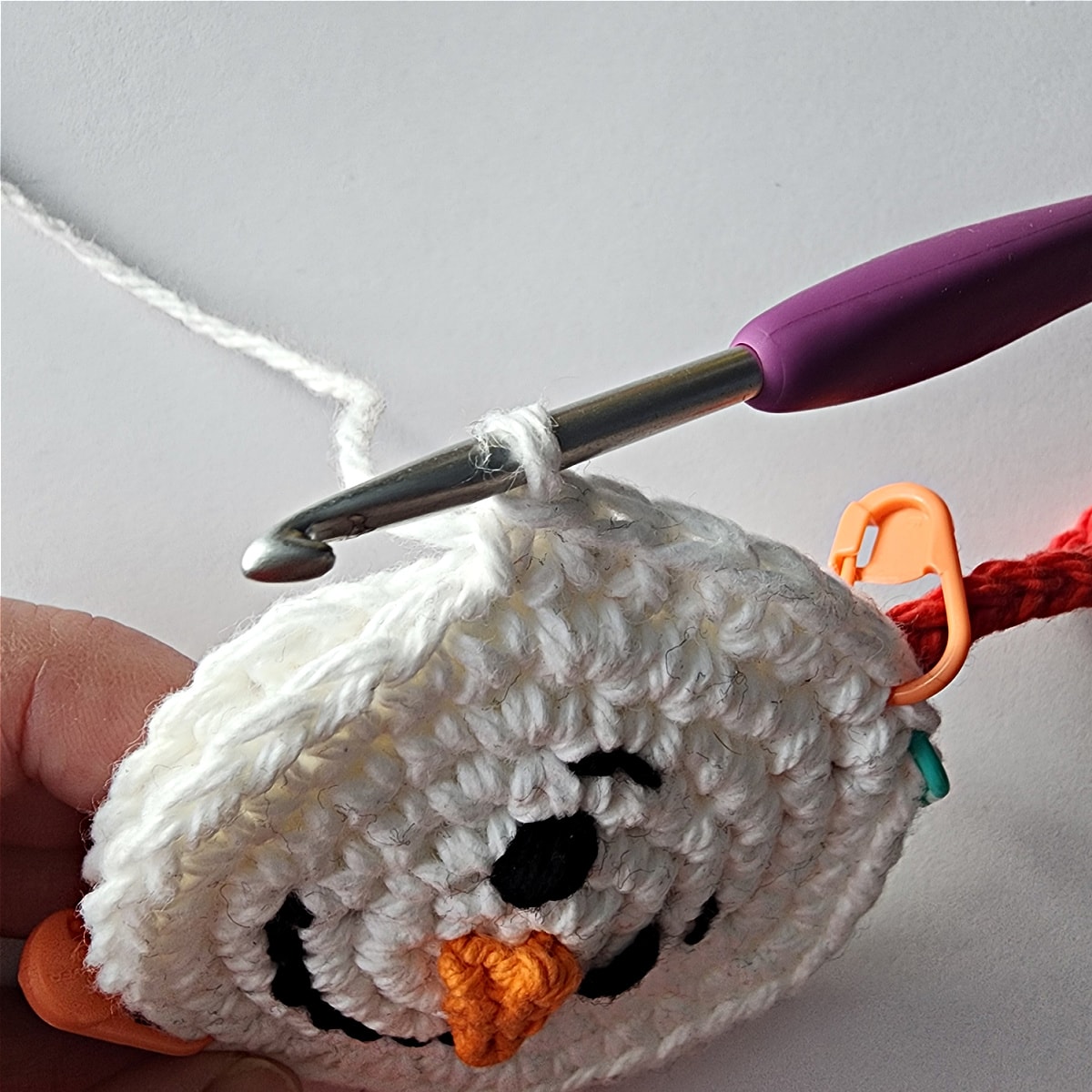 single crochet through both layers of snowmans head