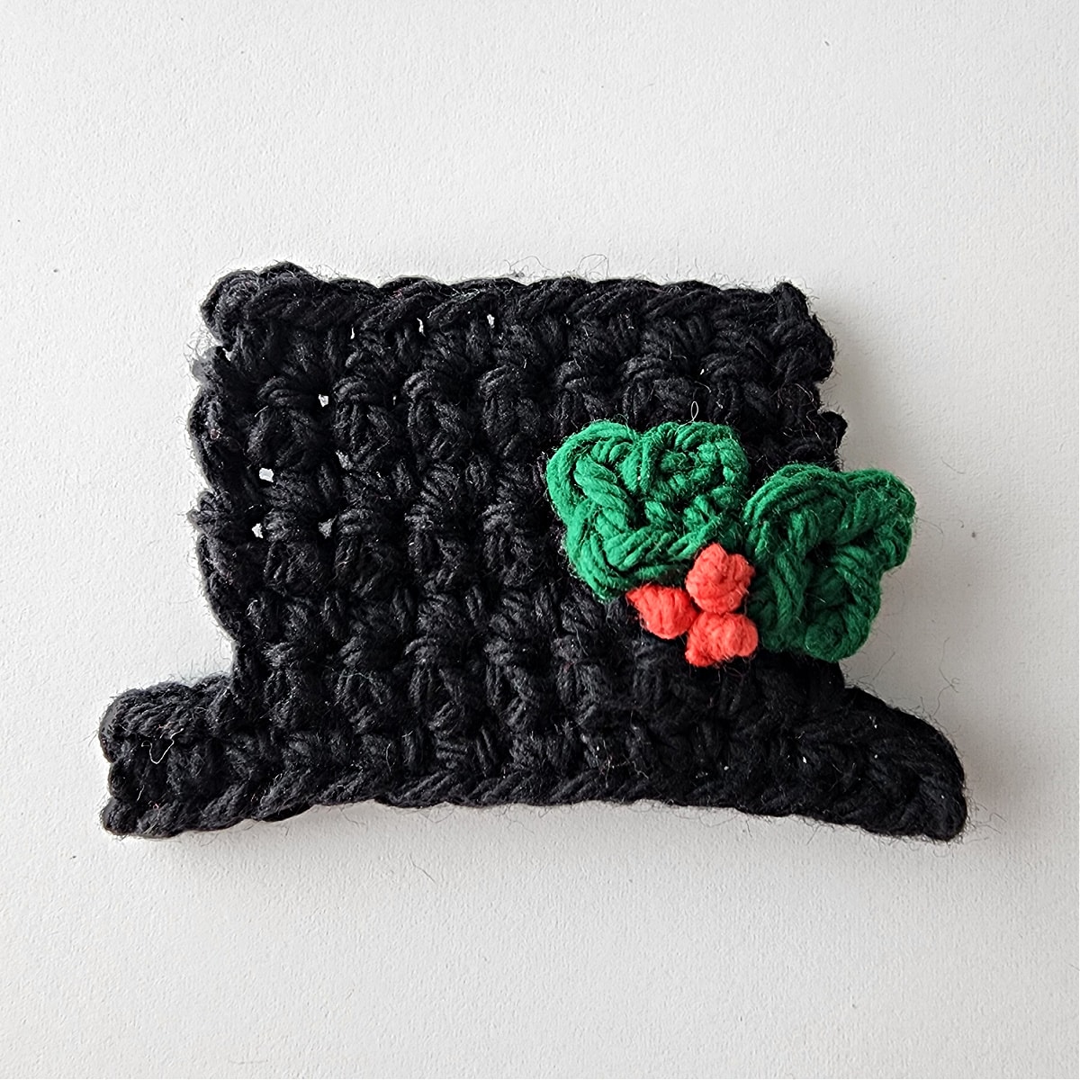 crochet snowman black hat with leaves and berries