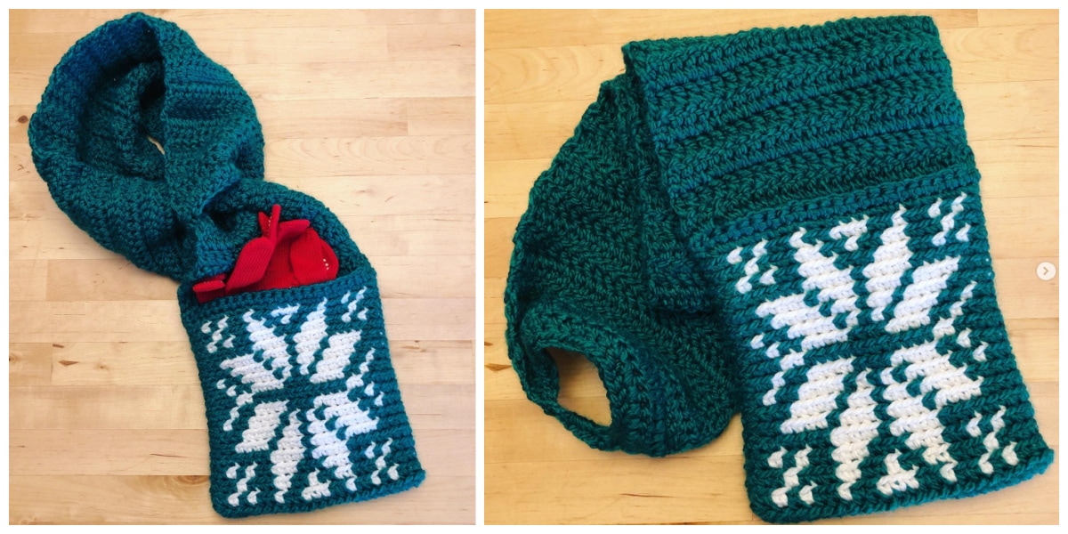 green and white snowflake crochet keyhole scarf with pocket laying on wood floor