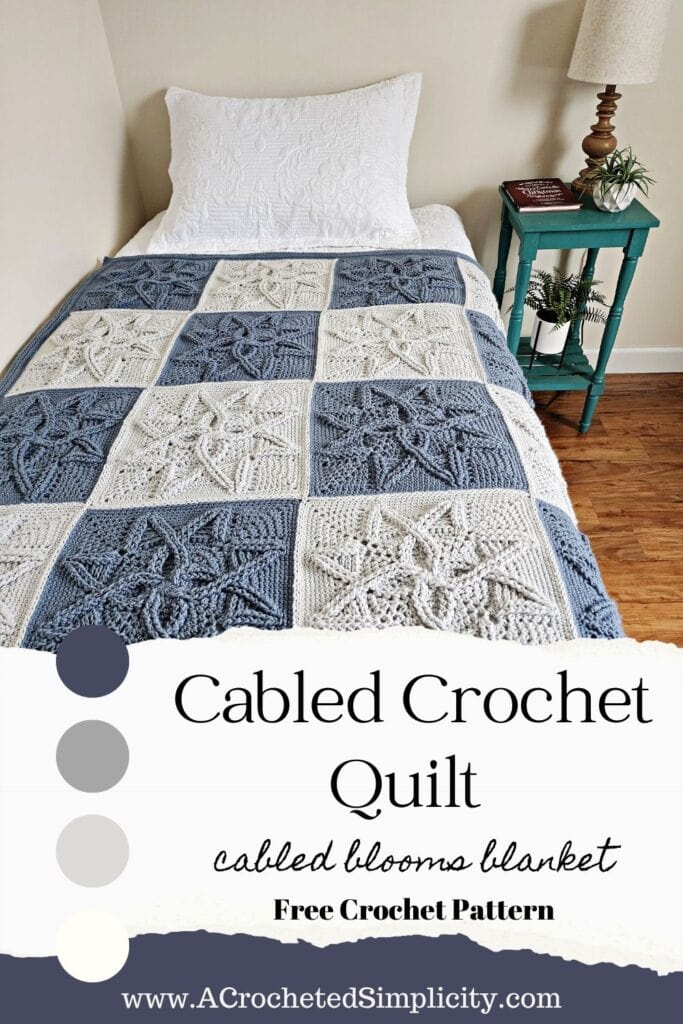 Steel blue and light grey crochet cabled blanket laying on bed.