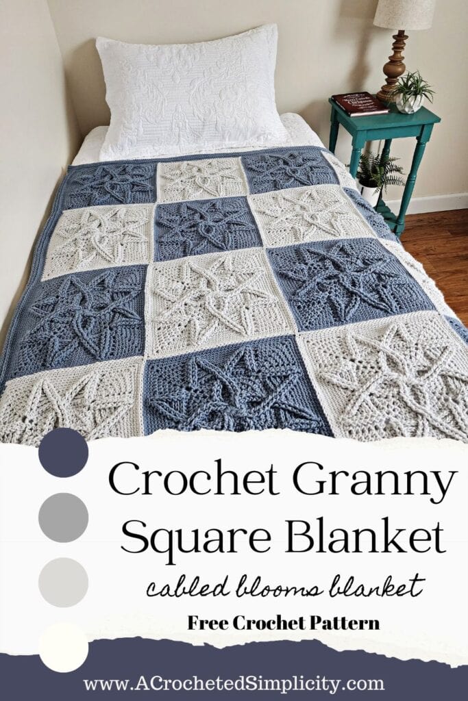 Steel blue and light grey cabled crochet blanket on top of twin bed.