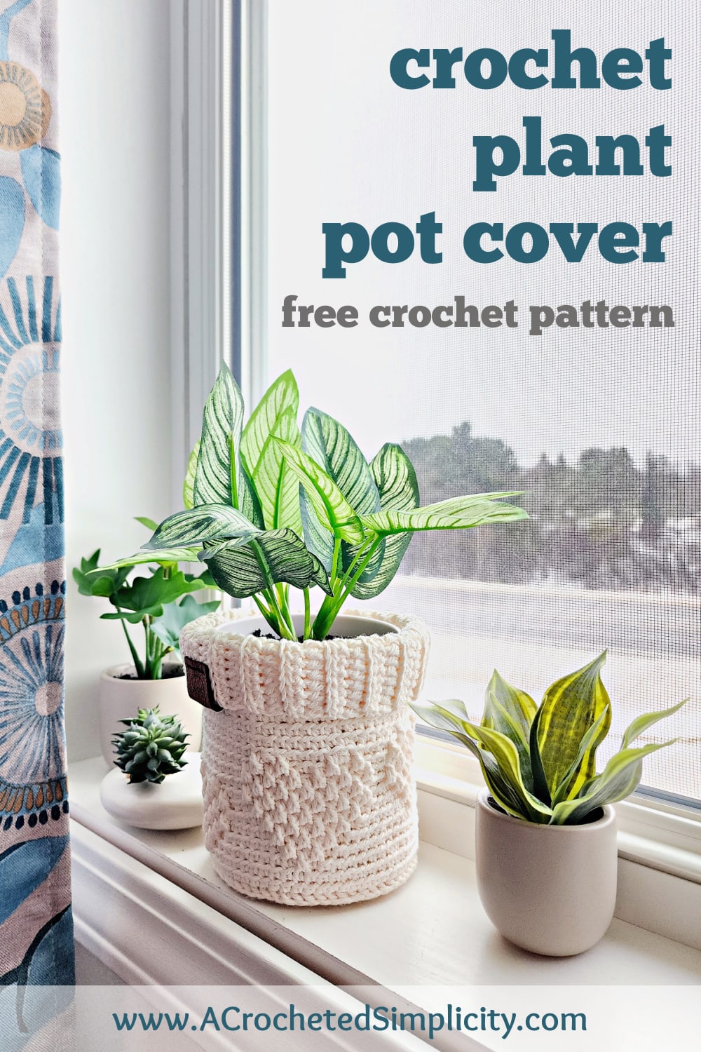 Cream color crochet plant pot cover with small hearts and ribbed crochet cuff sitting on a windowsill with small plants.