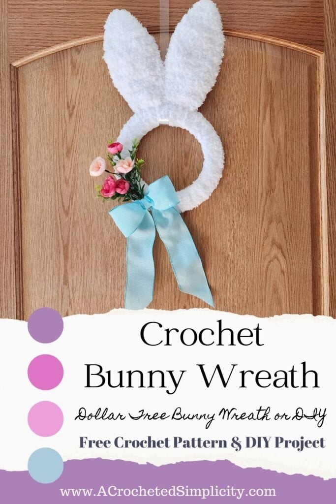 Crochet Easter bunny wreath with small floral spring and blue ribbon.
