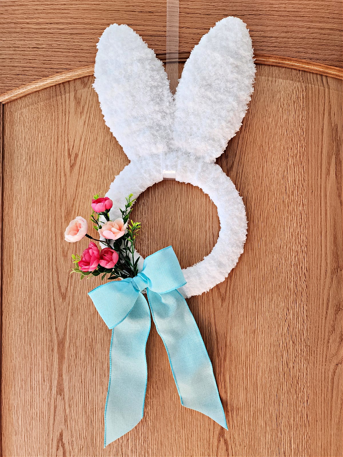 Bunny wreath made with Dollar Tree bunny wreath form.