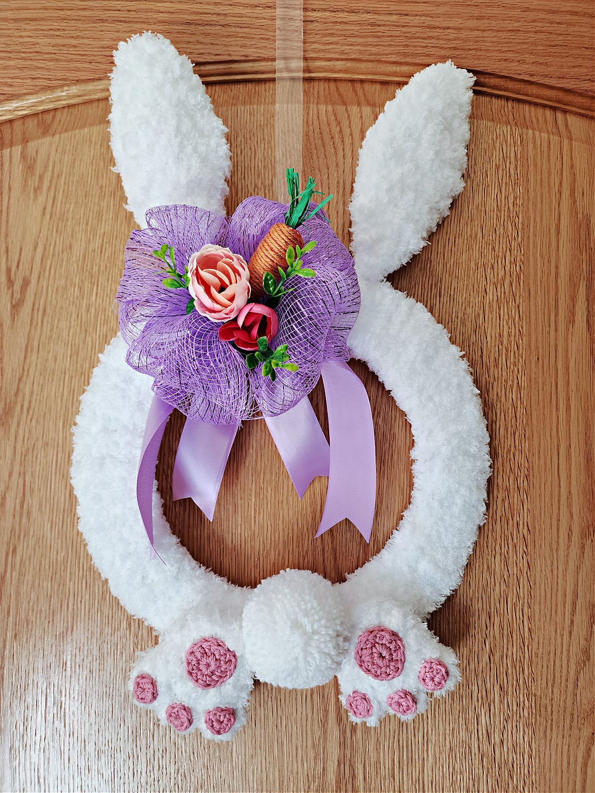 Crochet bunny wreath made with diy coat hanger bunny ears.