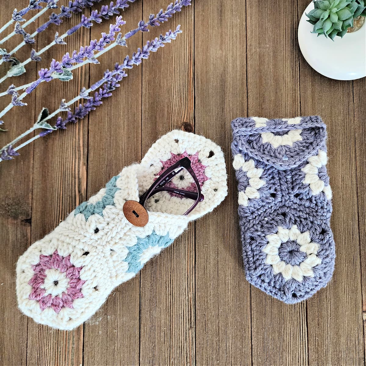 Purple glasses inside cream colored crochet eyeglasses case with lavender sprig.