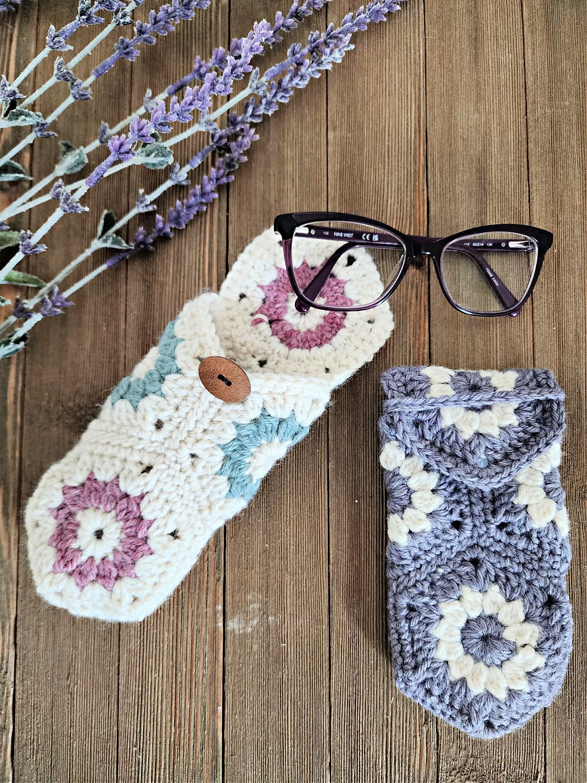 Purple and cream eyeglasses case crochet pattern with purple glasses laying on them.