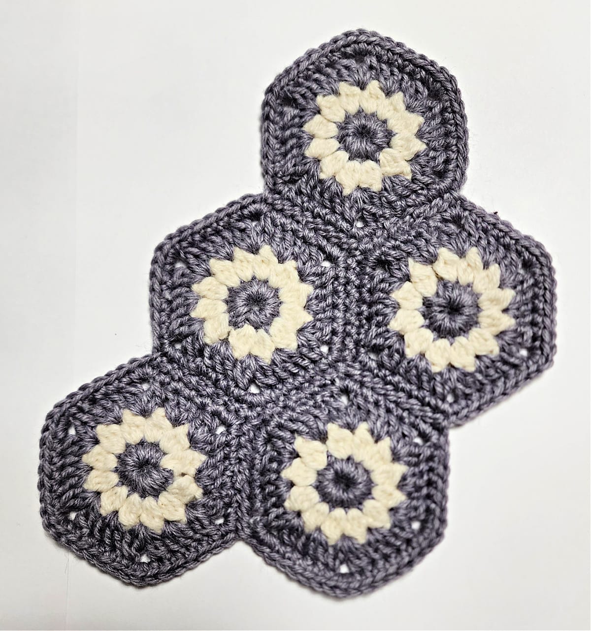 All five crochet hexagon motifs joined.