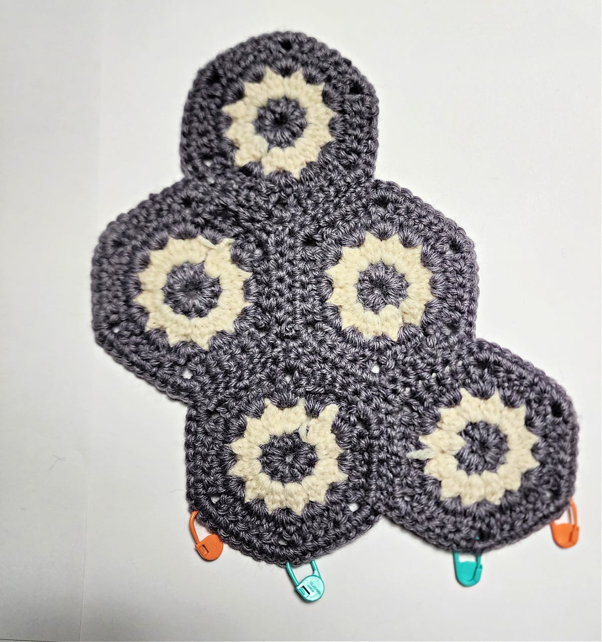 Hexagons with wrong side facing up to complete hexagon construction.
