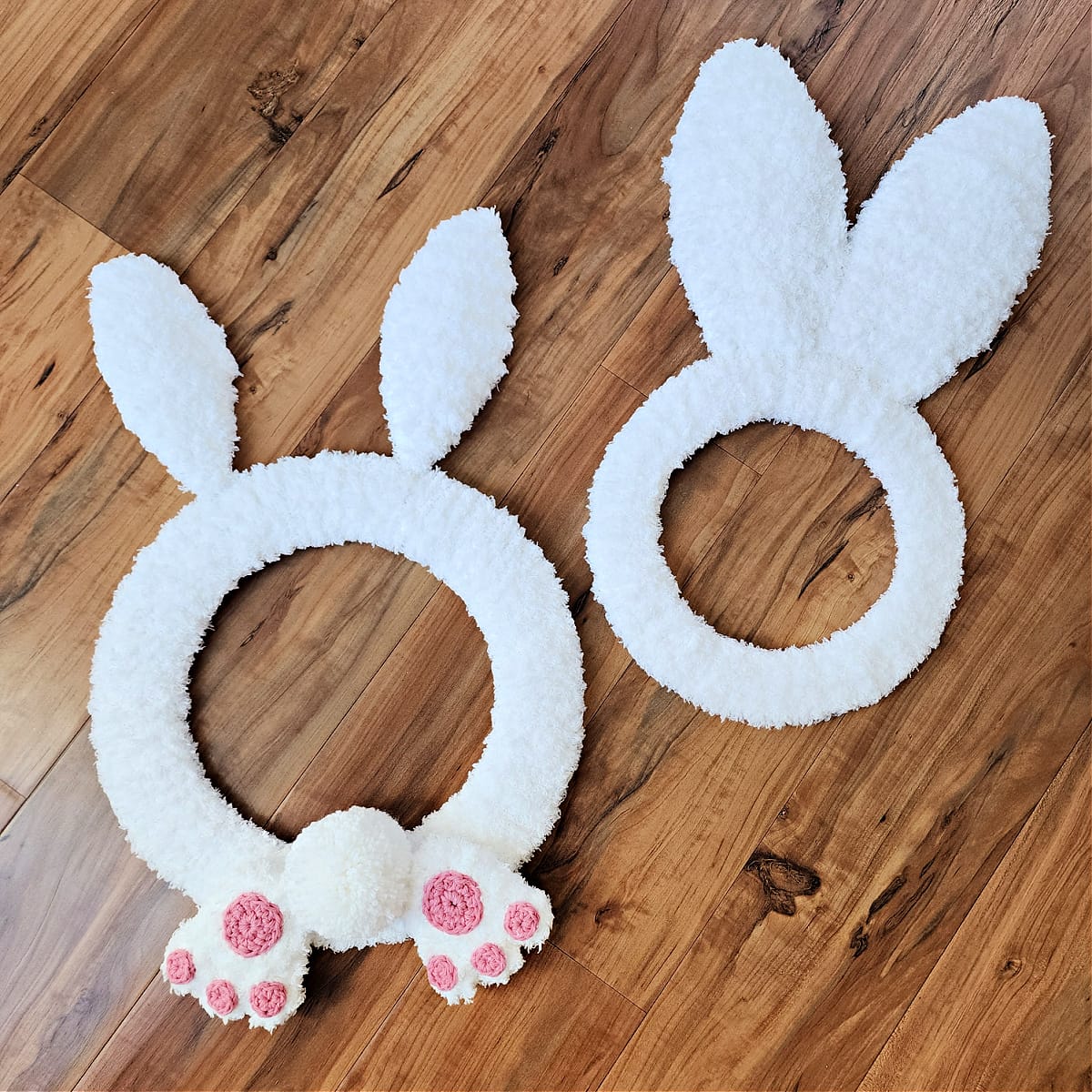 Bunny shaped wreath with crochet bunny feet and crochet bunny ears.