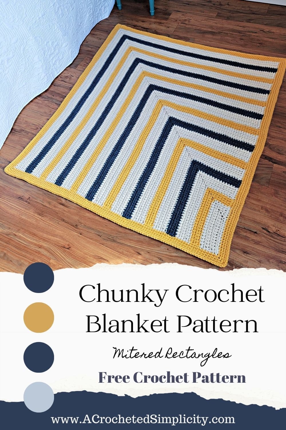 A striped chunky crochet blanket made with super bulky 6 yarn laying on wood floor.